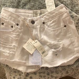 Distressed white shorts